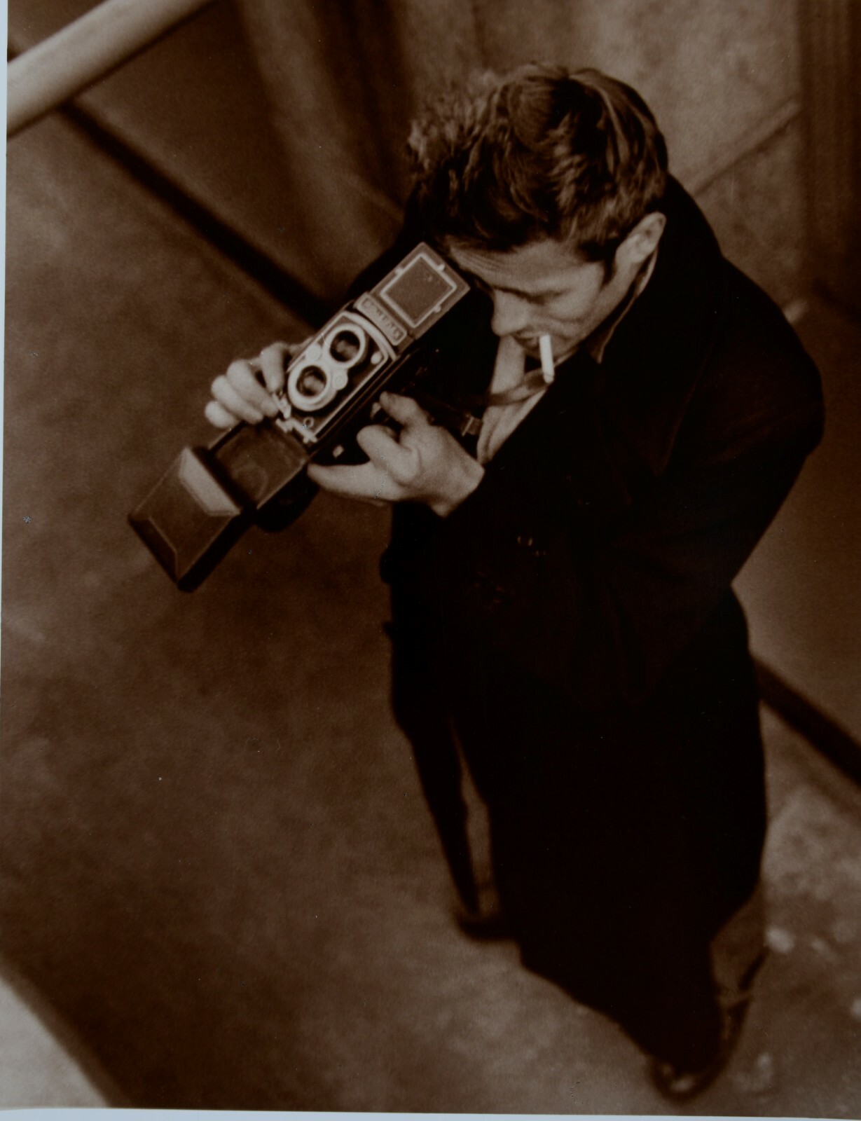 ROY SCHATT (1909–2002)James Dean with his Rolleiflex camera, New York 1954