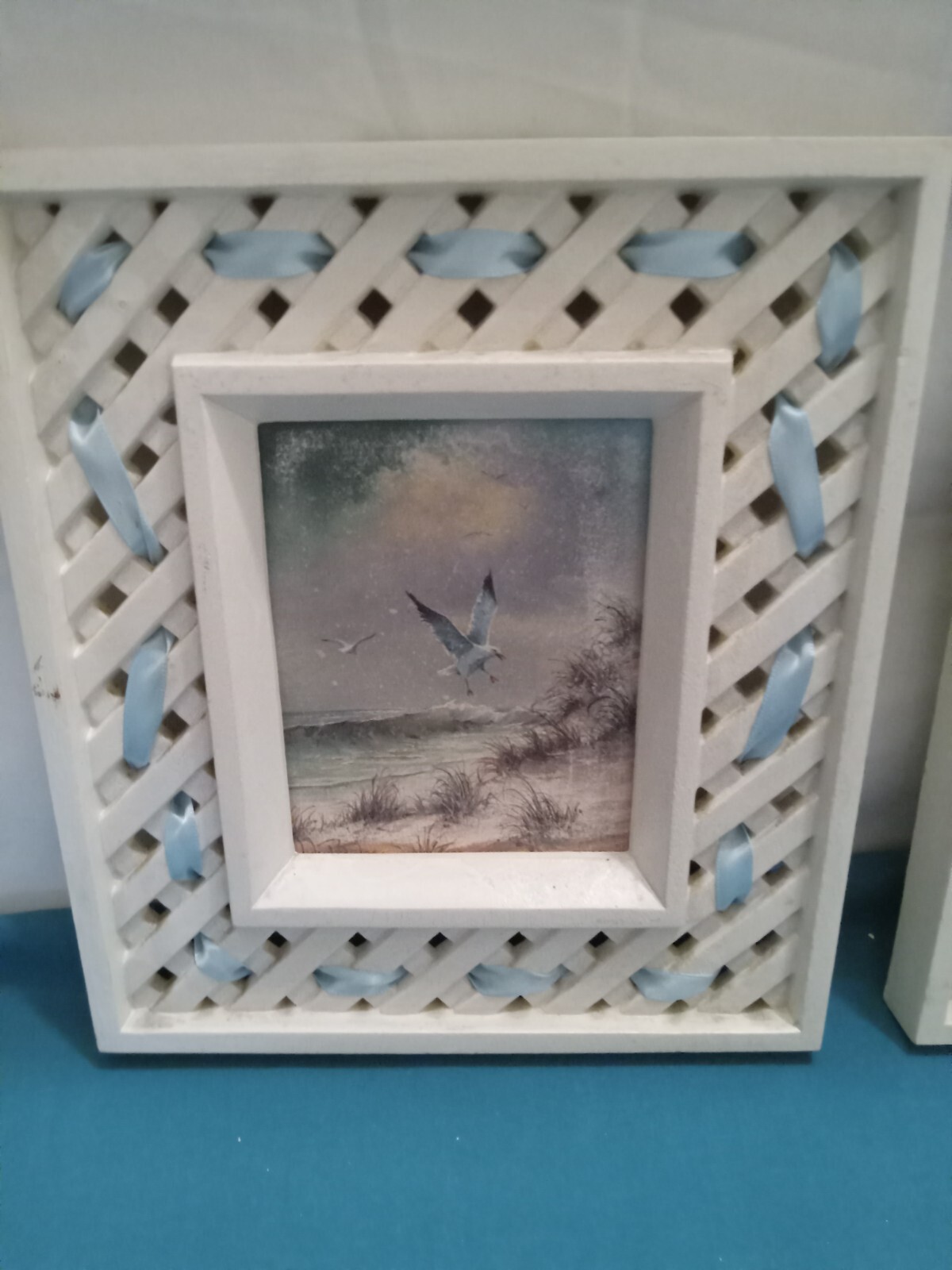 two sea gull pictures, measuring 9″ tall x 8″ wide. used in fair cond.