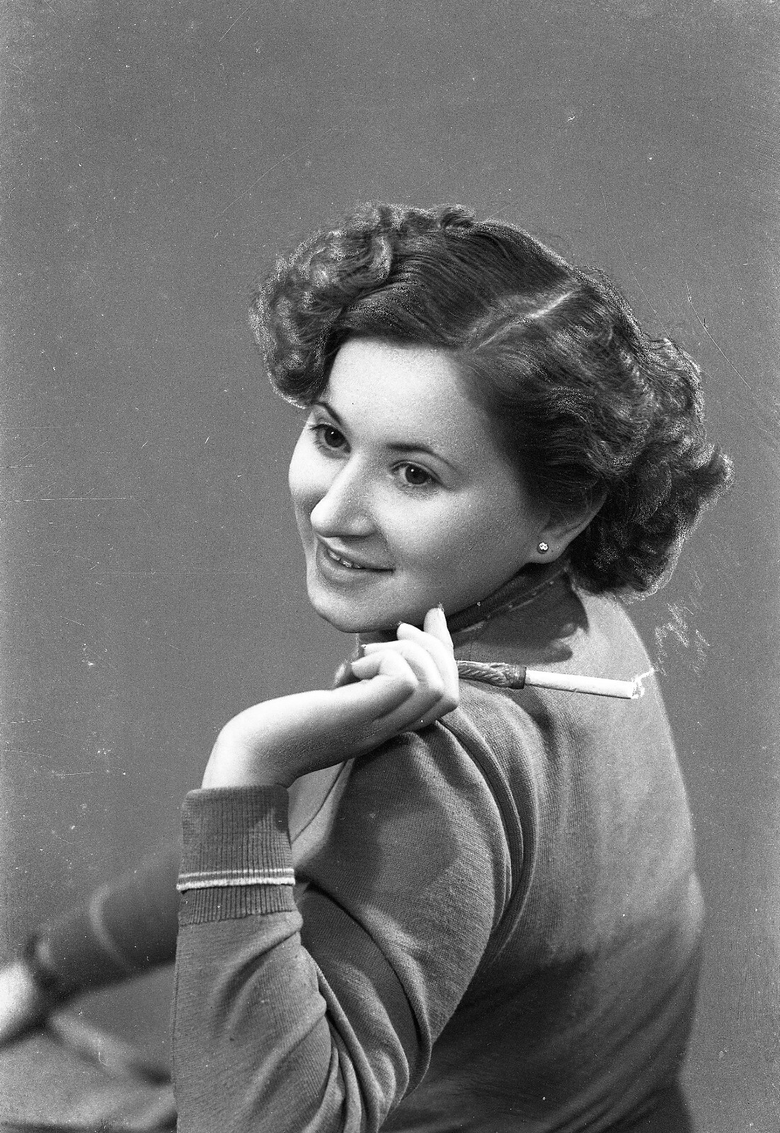 elegant woman smiling w cigarette, vintage fine art negative, 1940’s