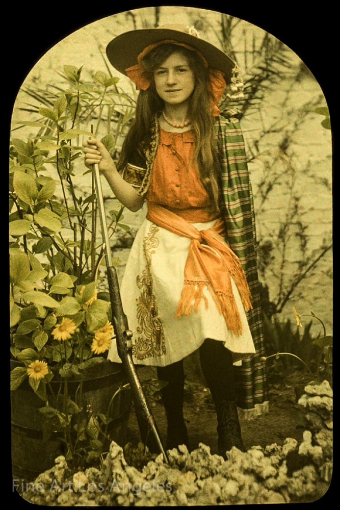 Autochrome Photo of young girl with rifle, early 1900s