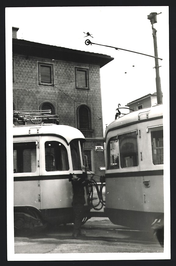 Photograph Milan, tram driver flips the overhead line of the tram