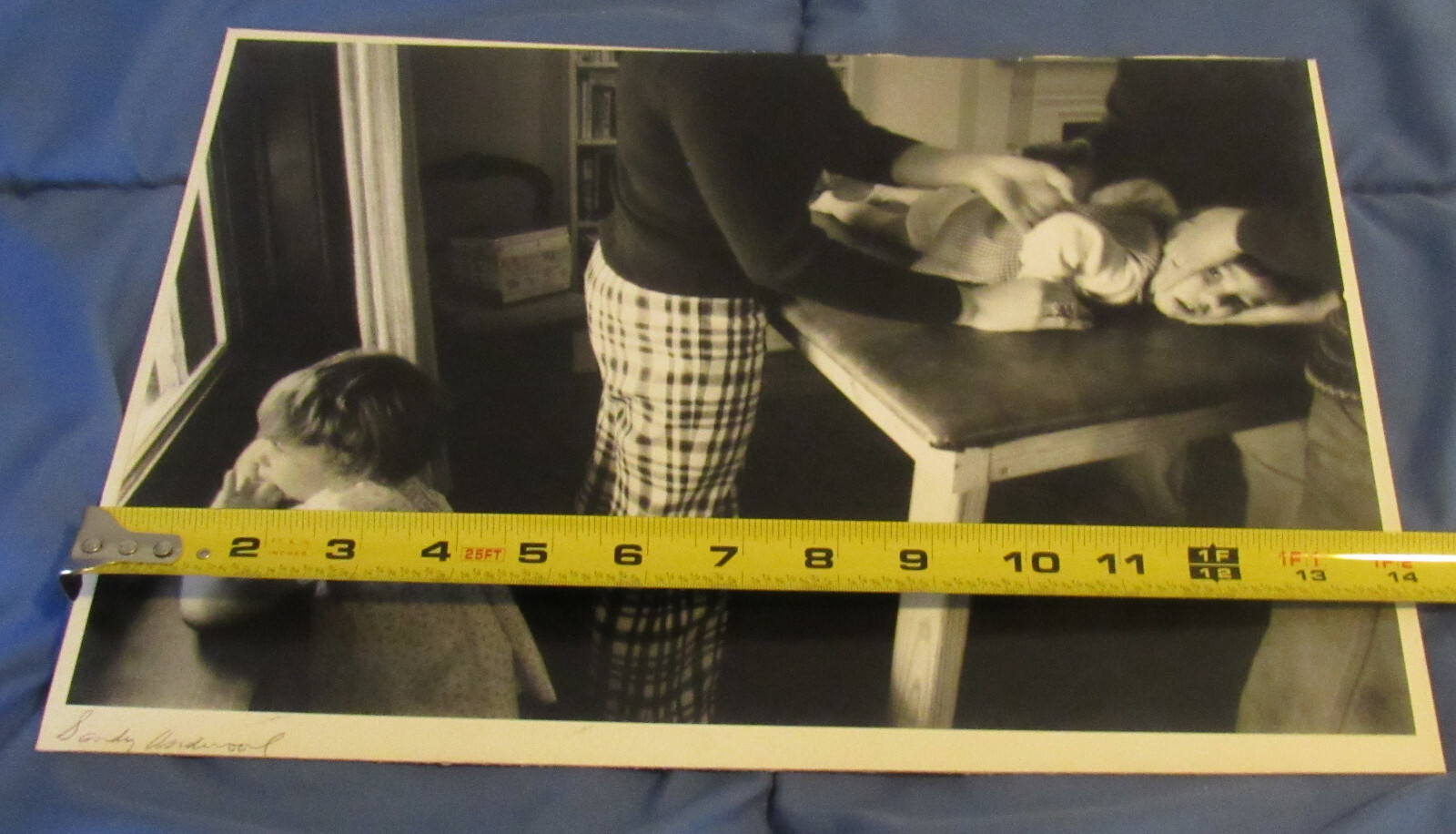 1977 Sandy Underwood photograph; Child on table, 9 1/2″ x 14″, Cincinnati Ohio