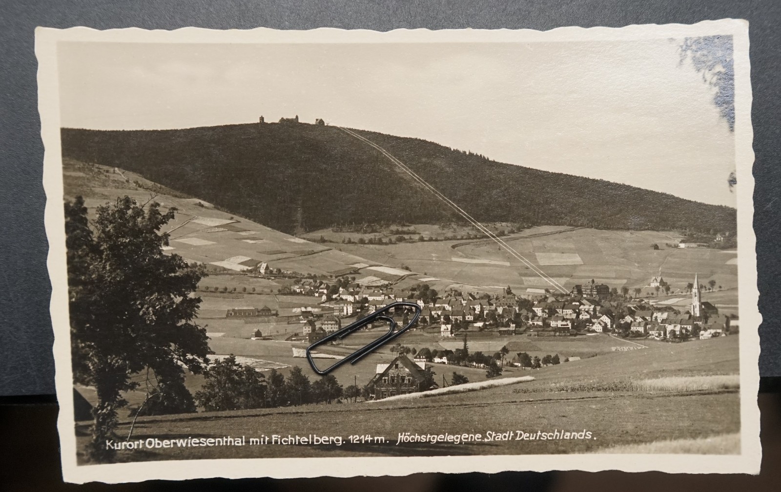 Photo postcard view GDR Oberwiesenthal Fichtelberg Erzgebirge church house