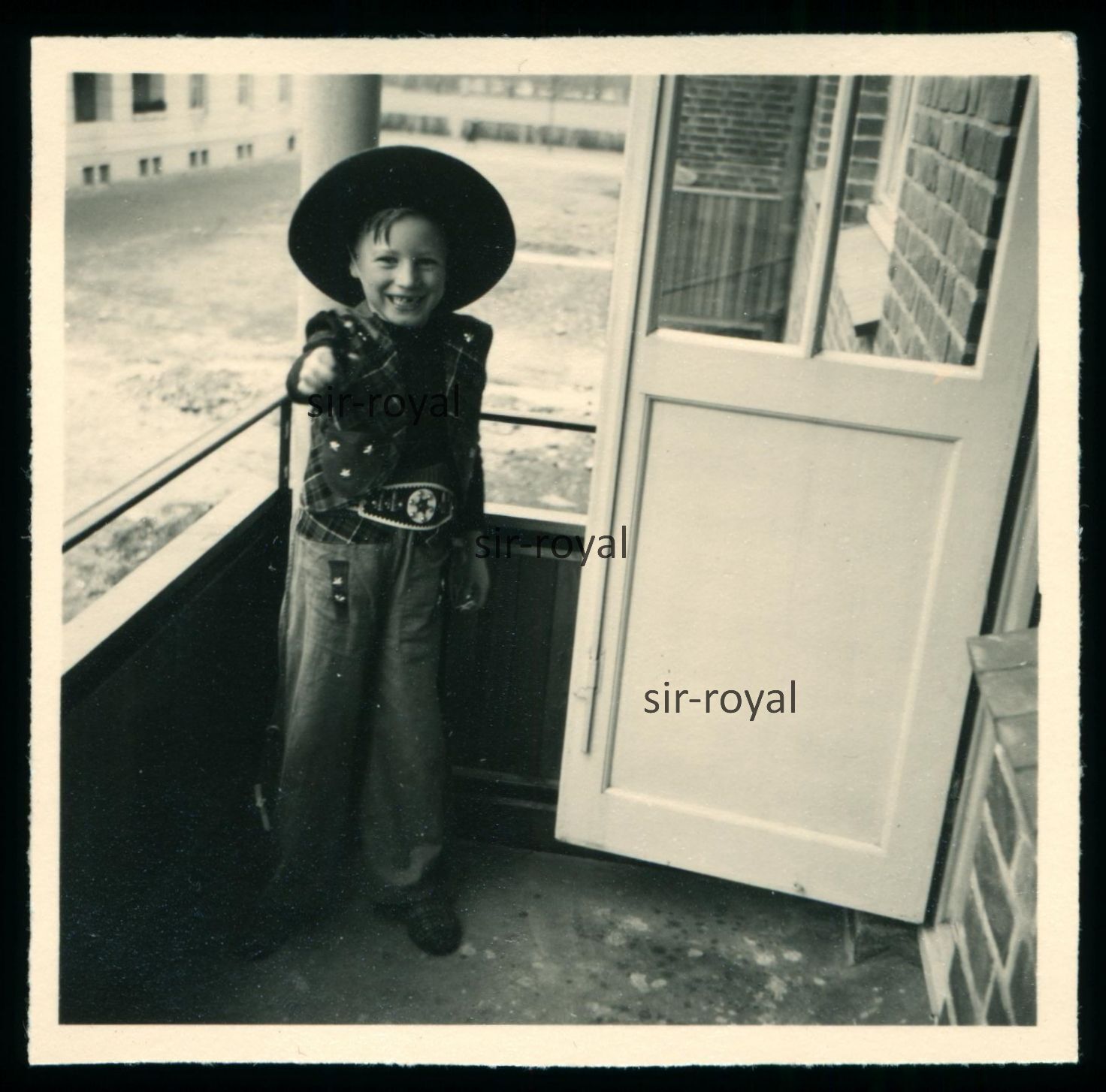 Boy in Cowboy Costume Aims at Camera with Revolver – 1960s – Photo 6x6cm
