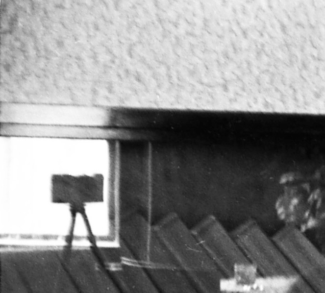 young couple kissing, photo camera on tripod, glass reflection, unusual, vintage