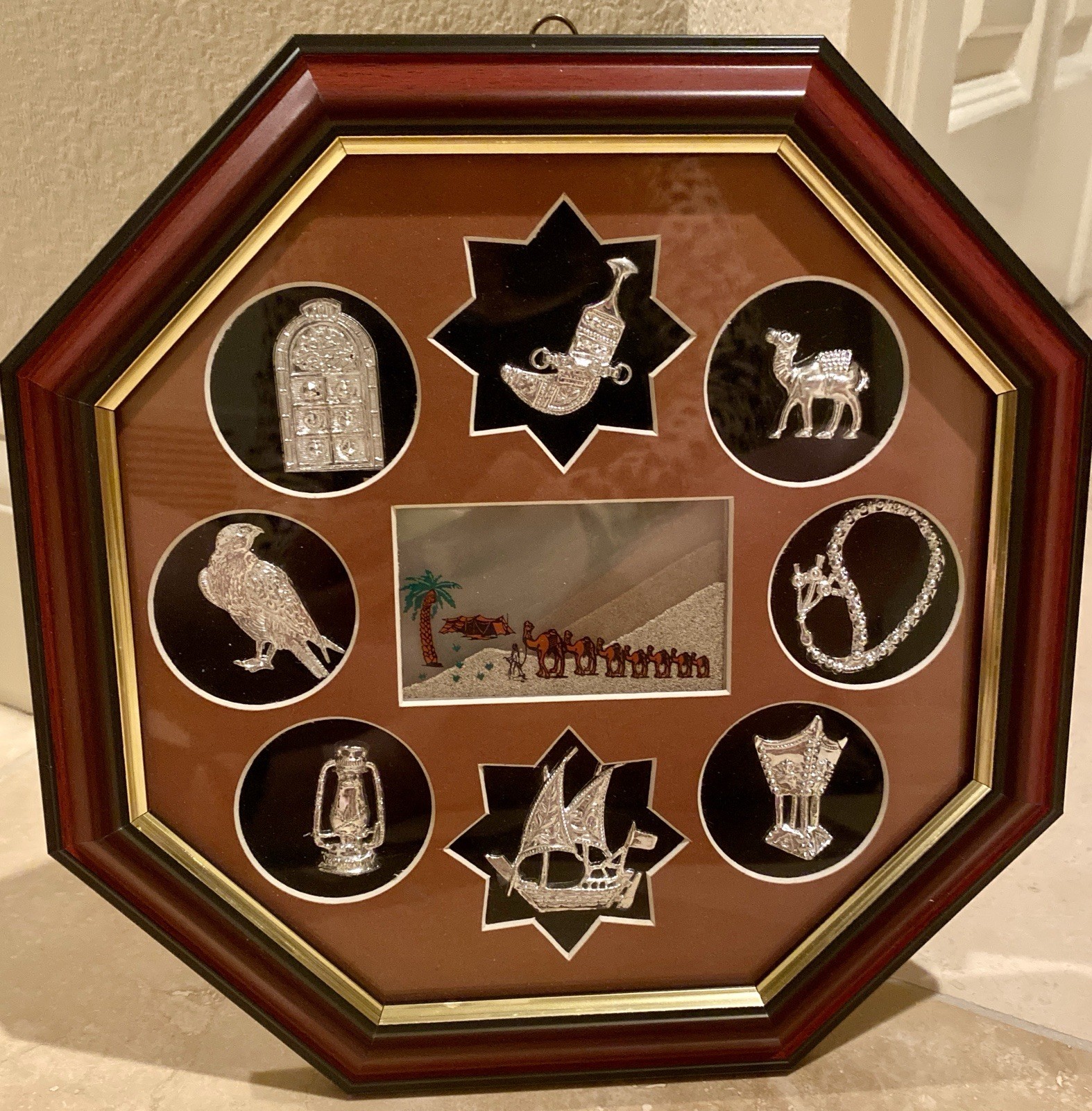 A combination of silver-tone miniatures and “Seven Sands” art.