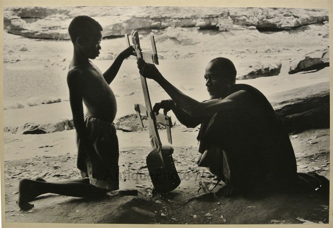Africa father and son making a mask vintage tribal art photo