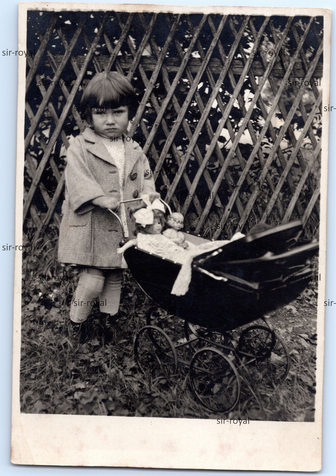 Skeptical Little Girl with Dolls Pram Circa 1930 – Photo 9x12cm
