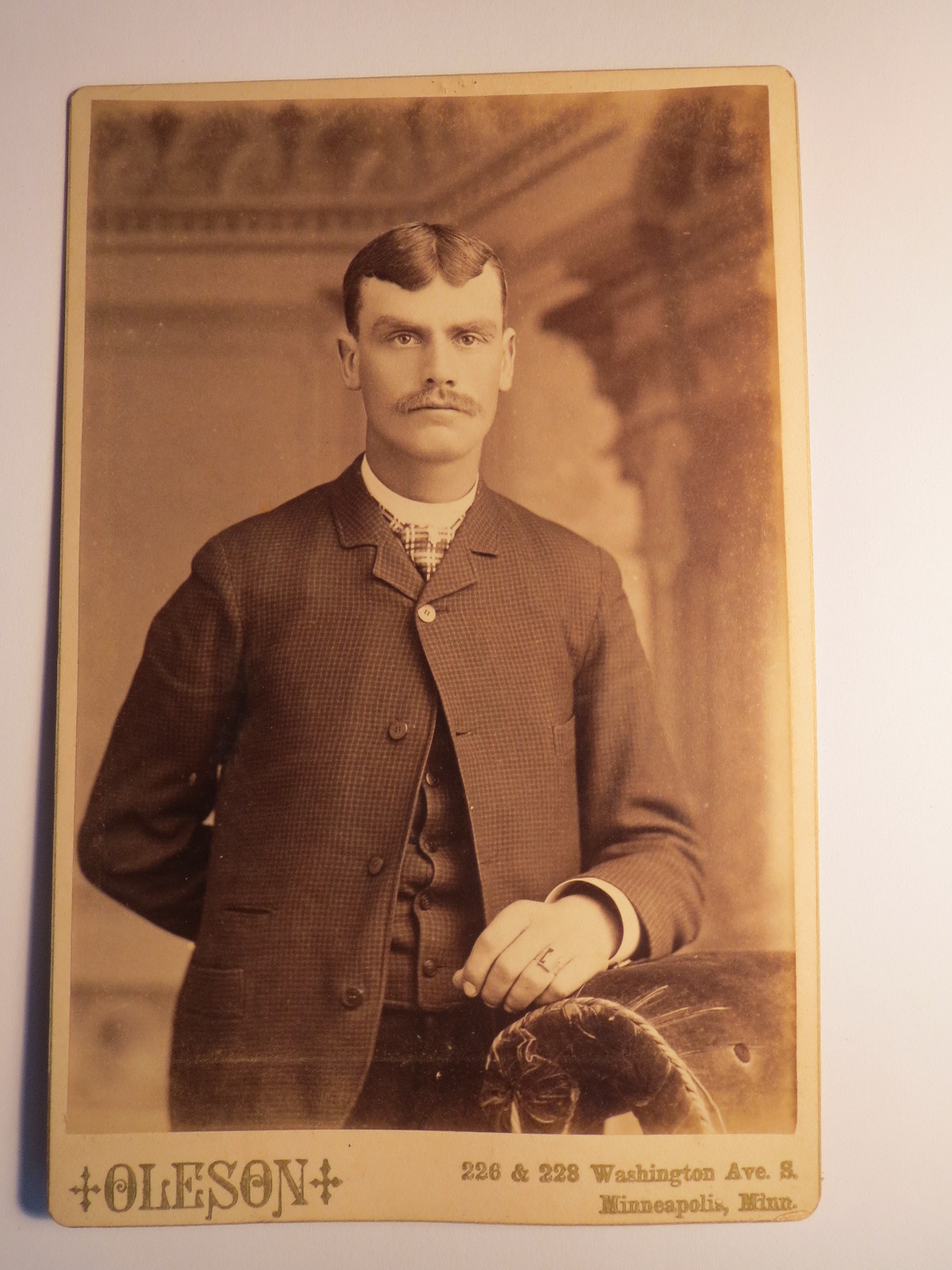 Minneapolis Minnesota USA – Standing Man in Suit – Backdrop / KAB