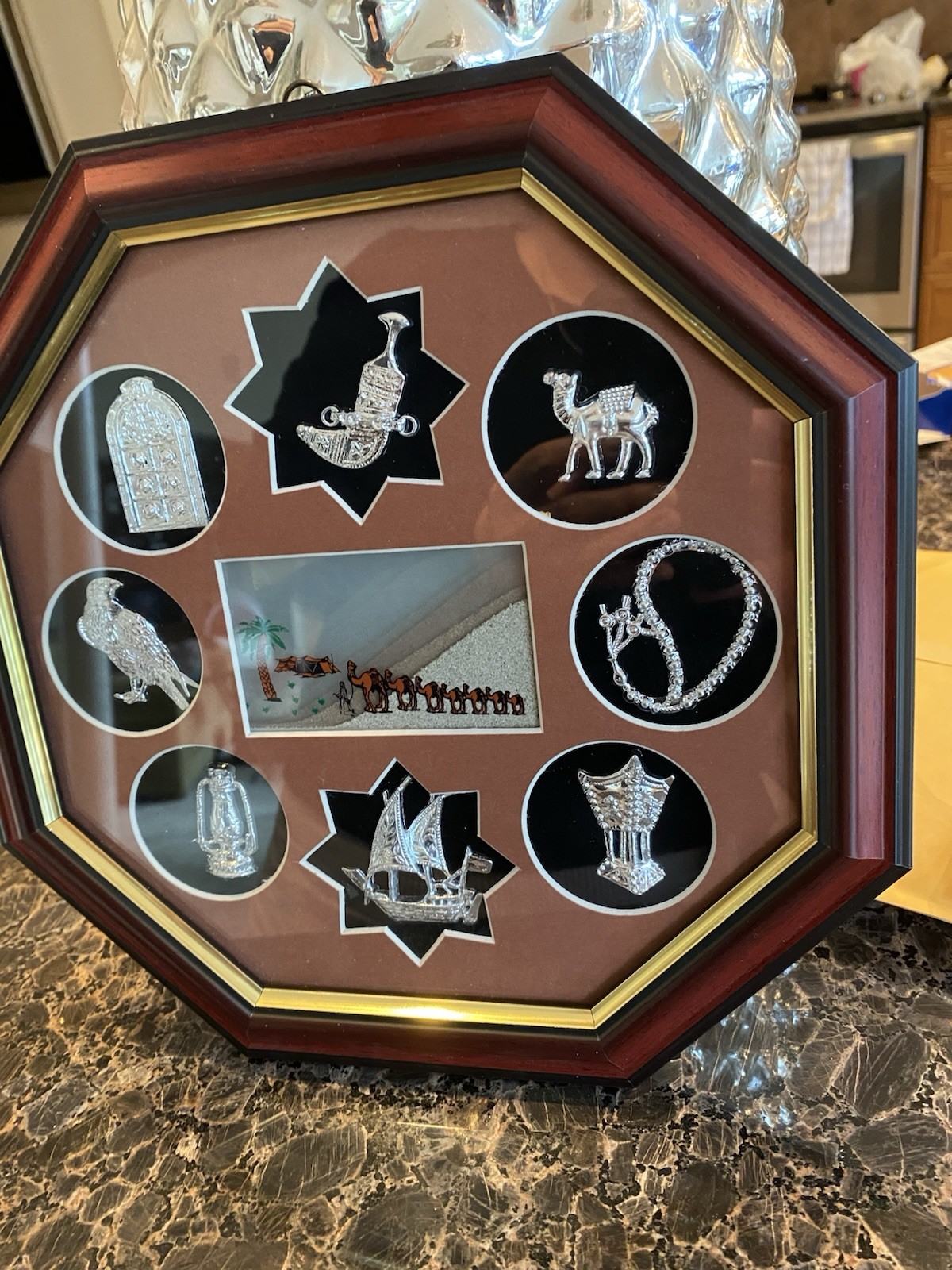 A combination of silver-tone miniatures and “Seven Sands” art.