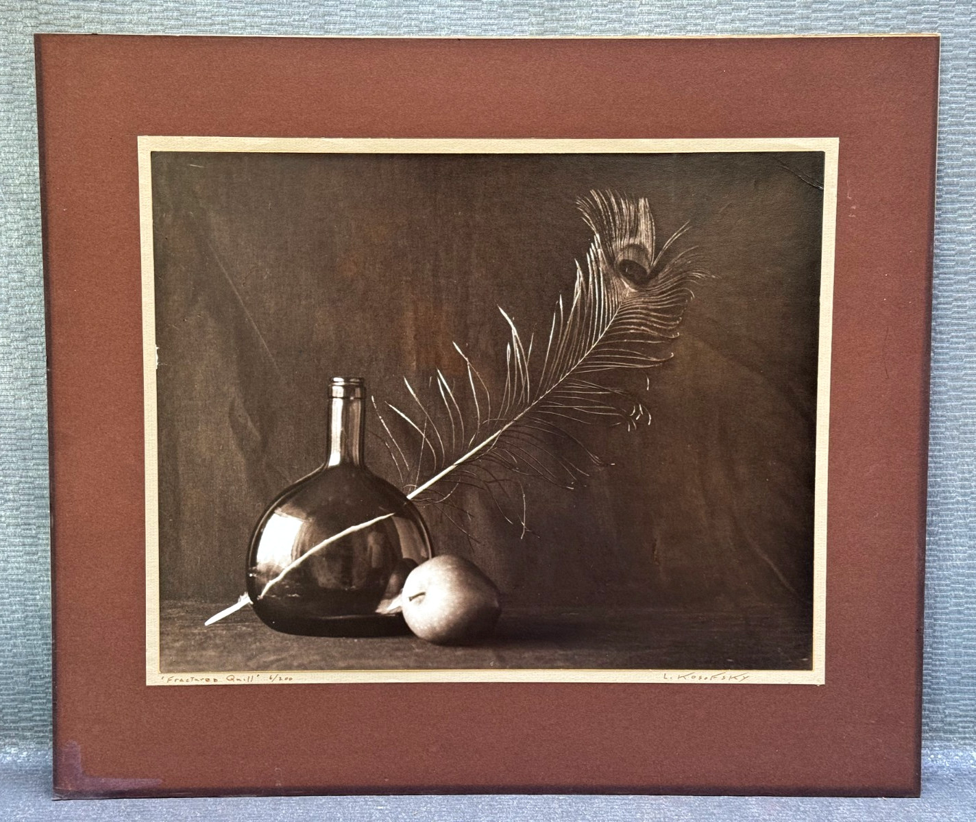 LEON KOSOFSKY SIGNED PHOTOGRAPH FRACTURED QUILL APPLE FEATHER WINE BOTTLE ART