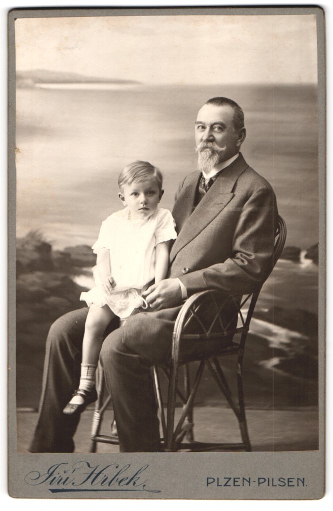 Photograph Jiri Hrbek, Pilsen, father in suit with his son on his lap
