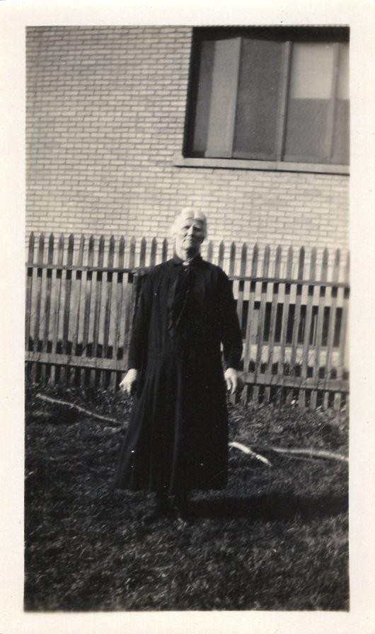 Vintage Black & White Photo Woman Outside Picket Fence Brick House 1930s-50s