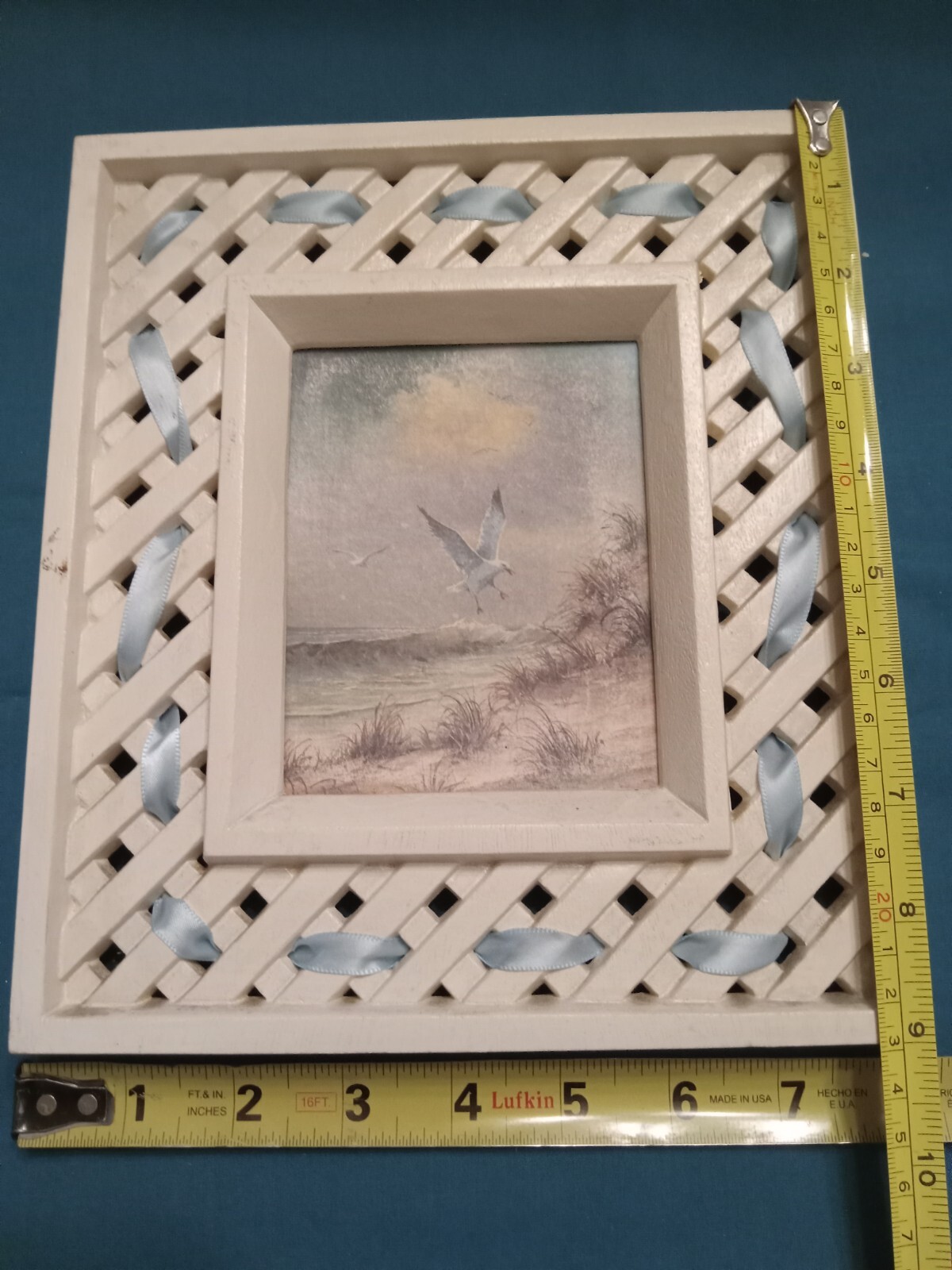two sea gull pictures, measuring 9″ tall x 8″ wide. used in fair cond.