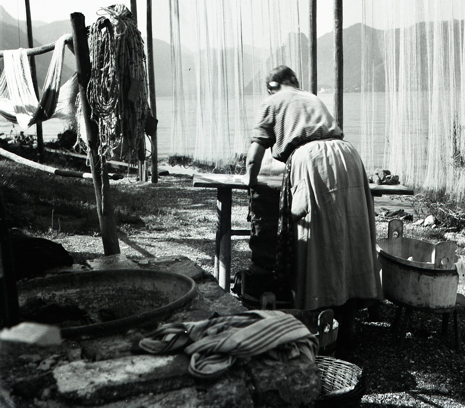 Salzkammergut , Austria, village, woman w traditional fishing net, by Eduard PEZ
