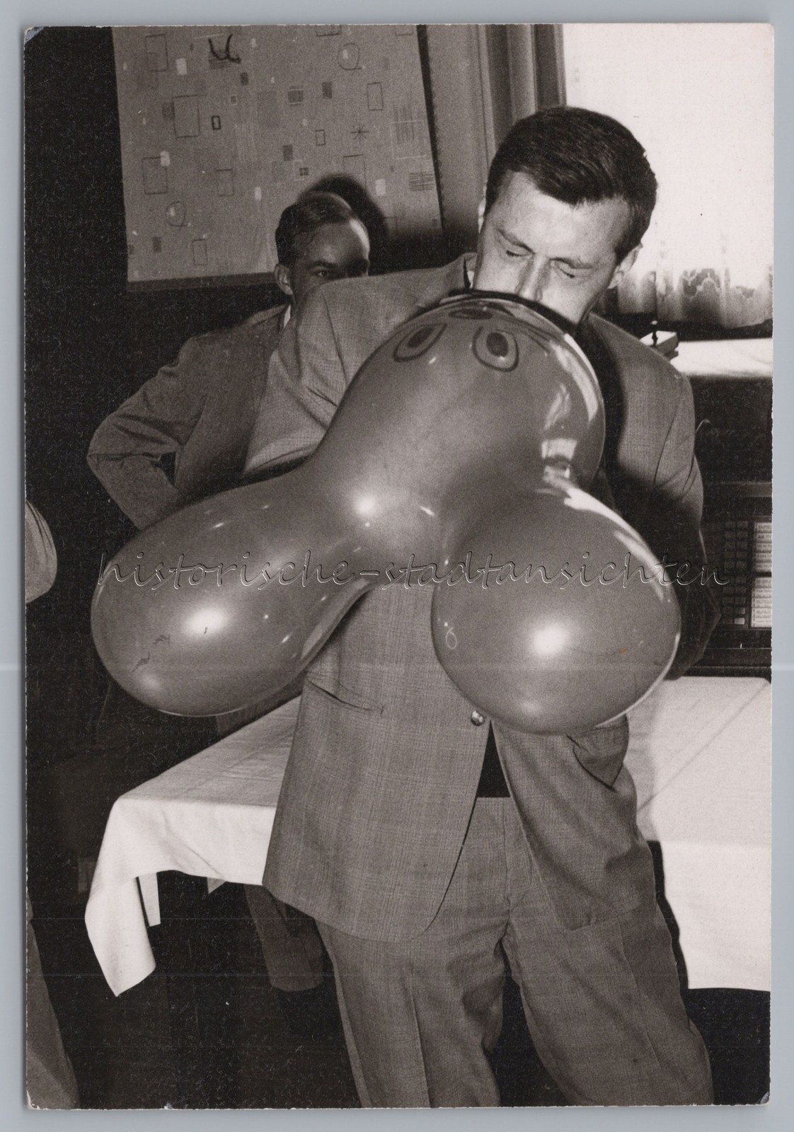 Man Blows Up Mickey Mouse Balloon – Vintage Photo