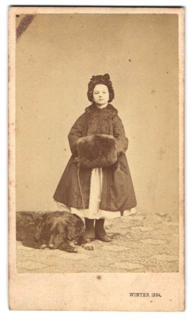 Photograph M. L. Winter, Prague, pretty girl in winter coat with muff and her